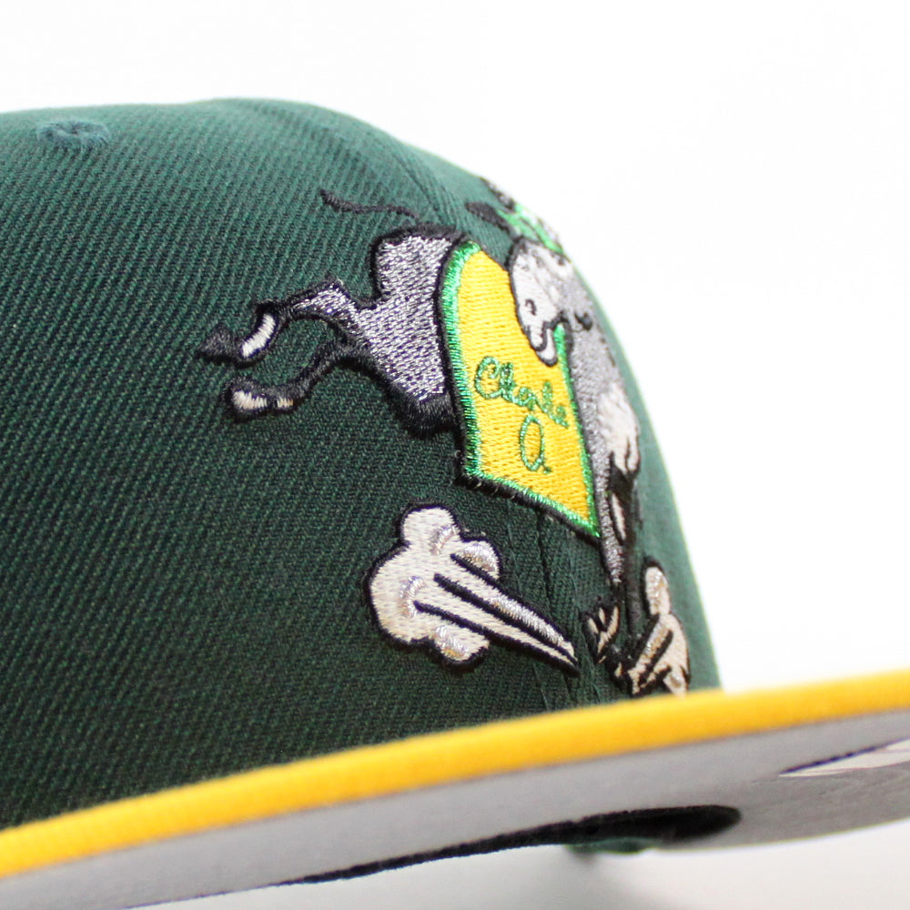 https://www.ecapcity.com/cdn/shop/files/Oakland-Athletics-First-Mascot-_-Charlie-O-the-Mule-New-Era-59Fifty-Fitted-Hat-_Green-Gold-Gray-Under-Brim_-6.jpg?v=1702573794